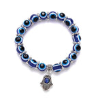 Blue glass evil eye bead stretch bracelet with silver-tone hamsa hand charm, Kharze Zarka