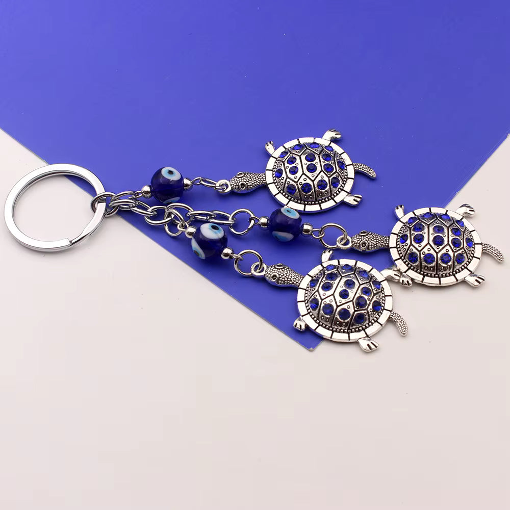 Shell Yeah evil eye keychain, view 2, Kharze Zarka