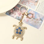 Protected in my Shell evil eye keychain, view 3, Kharze Zarka