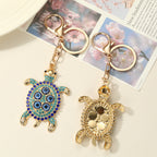 Protected in my Shell evil eye keychain, view 5, Kharze Zarka